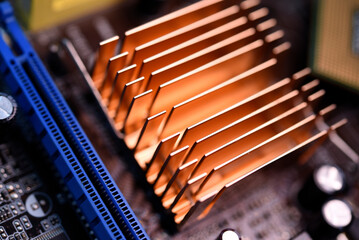 Wall Mural - A copper radiator for cooling the chip on the computer board. Radio components.The computer's motherboard.