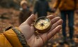 a child's hand holding a compass, family in the background ready for a day of exploration
