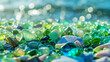 The seaside comes alive with vibrant hues as green and blue shiny glass mixes with multi-colored sea pebbles, their polished textures shimmering under the sun