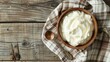 In a wooden bowl, serve yogurt or sour cream