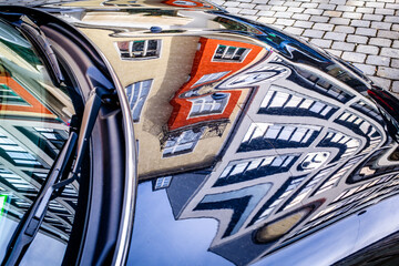 Canvas Print - typical reflection of a facade at a car