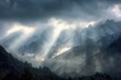 Sun rays break through clouds over a mountain range after a storm, creating a dramatic scene in the sky
