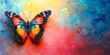A butterfly sits on the wall with colorful paint brush strokes. Abstract modern art.