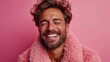   A tight shot of a man in a pink coat, grinning, with closed eyes and windswept hair
