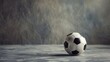 Artistic shot of a football on grey background.
