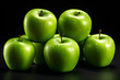 green apples on a black background
