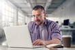 © BillionPhotos.com - Young successful businessman at workplace with laptop