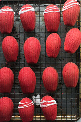 Sticker - overhead view of red madeleines cake or cookies on baking rack