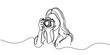 The girl takes pictures with the camera. One line is continuous. Vector illustration