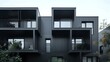 Contemporary black modular private townhouses. External architecture of residential buildings