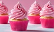 Delicious cupcakes with pink buttercream frosting on light background