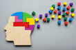 Neurodiversity concept. Head made of colored puzzles and cubes. Positivity and creativity.