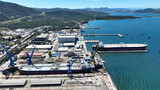Fototapeta Paryż - Aerial drone photo of port town and recently renovated ship yard of Skaramagas in Western area of Attica, Elefsina bay, Attica, Greece