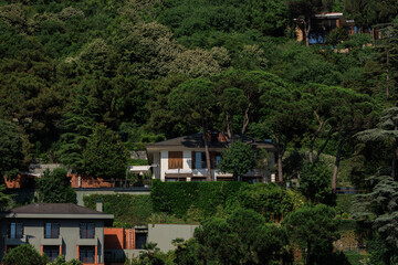 Sticker - Beautiful houses and city streets of the southern city with green plants, public place in Turkey, on a summer sunny day