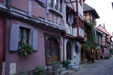 Canvas Print - closeup on downtown Eguisheim in eastern France, Alsace with their typical half timbered colorful buildings