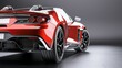 © JovialFox - Rear view of modern fast sports car in studio light.
