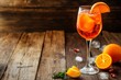 A glass of Aperol spritz cocktail on a wooden table, spritz cocktail on a wooden table, cocktail closeup, cocktail isolated, halal cocktail, fruits cocktail, healthy cocktail, fresh cocktail 