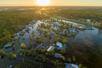 Poster - Aftermath of natural disaster. Surrounded by hurricane Ian rainfall flood waters homes in Florida residential area