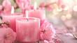 Velas aromáticas rosa com flores rosas no fundo