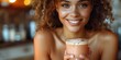 Smiling African American woman in kitchen drinking dietary supplements promoting a healthy lifestyle. Concept Healthy Lifestyle, Dietary Supplements, African American Woman, Kitchen, Smiling