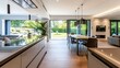 Contemporary kitchen and open plan living room with garden aspect