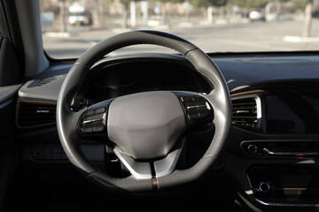 Wall Mural - Black steering wheel and dashboard in modern car