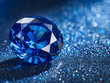 A blue diamond is sitting on a shiny surface. The diamond is surrounded by a lot of sparkles, giving it a very luxurious and elegant appearance