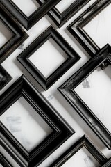 Poster - A collection of black picture frames displayed on a wall. Perfect for home decor projects