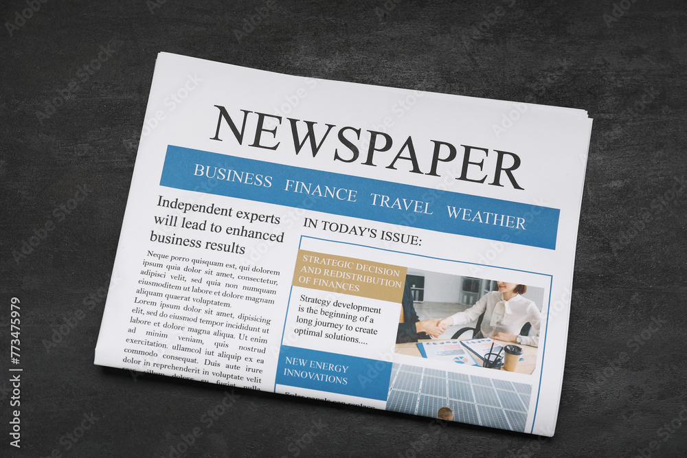 Newspaper on black grunge background