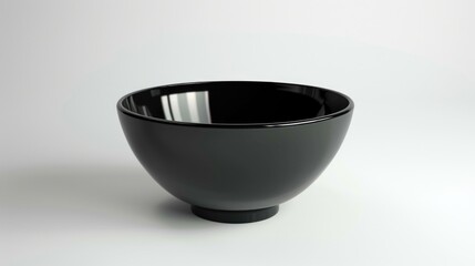 Aufkleber - A black bowl on a white table, suitable for kitchen or dining room themes
