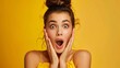 beautiful woman with surprised face on yellow background