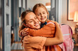 Morning hug from mom. Loving daughter embracing smiling parent before school