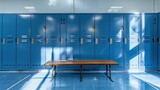 Fototapeta Big Ben - Blue metal storage lockers with an accompanying wooden bench are situated in a locker area, with various doors in different states of open or closed
