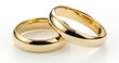 Two gold wedding rings are shown on a white background. Generative AI.