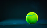 Fototapeta Sport - Padel or tennis ball. Background with copy space. Ball at sports court. Social media template. Promotion for padel events.