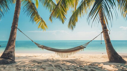 Wall Mural - A hammock strung between two palm trees on a beach embodies the ultimate holiday and vacation dream. Bahamas