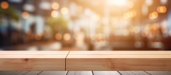Wall Mural - A wooden surface serving as a tabletop with a background of buildings in a city with blurred features