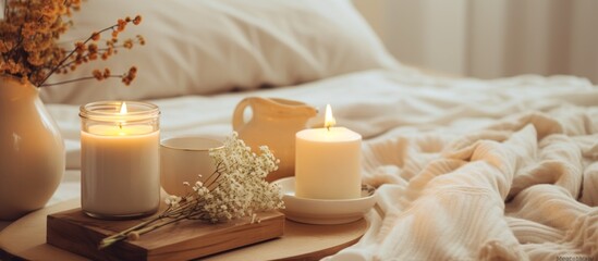 Poster - A bed with a cozy blanket has a tray holding candles and flowers placed on top of it