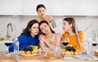 © JackF - Frustrated and distressed Spanish woman sits in kitchen and complains to her female friends, talks about her difficulties at work, problems, vicissitudes. Women friends give advice, reassure, support