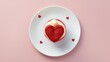 Minimalist flat lay of a single red velvet cupcake with a heart-shaped topping background, clean and romantic cupcake