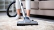 Woman using vacuum cleaner maintains clean cozy living environment. Woman uses vacuum cleaner to keep living space tidy. Woman with vacuum cleaner in hand ensures home remaining tidy place to live.