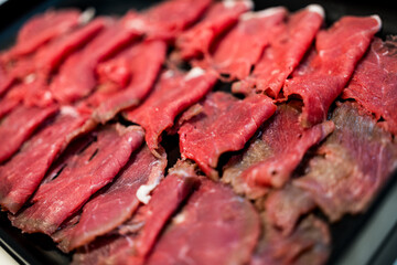 Wall Mural - Sliced raw beef meat for hot pot, yakiniku, sukiyaki and shabu.