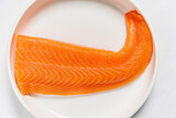 Fototapeta Boho - salmon fillet on the white plate