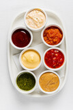 Fototapeta Kwiaty - different sauces on the white, top view