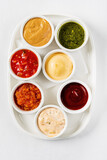 Fototapeta  - different sauces on the white, top view
