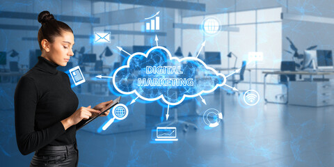 Poster - Thoughtful young woman using tablet with creative blue polygonal cloud digital marketing hologram with icons on blurry office interior background. Strategy and business concept. Double exposure.