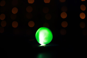 Wall Mural - Background with glowing ball and bokeh. Ball for predictions. Clairvoyant ball.