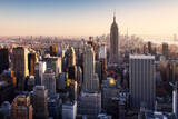 Fototapeta Mosty linowy / wiszący - New York City with skyscrapers at sunset, USA