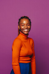 Happy woman with stylish braided hair on vibrant purple background.