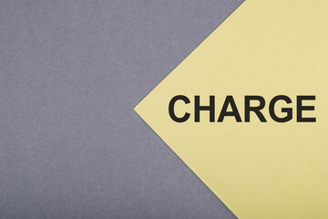 Wall Mural - CHARGE text written on yellow paper with notebook